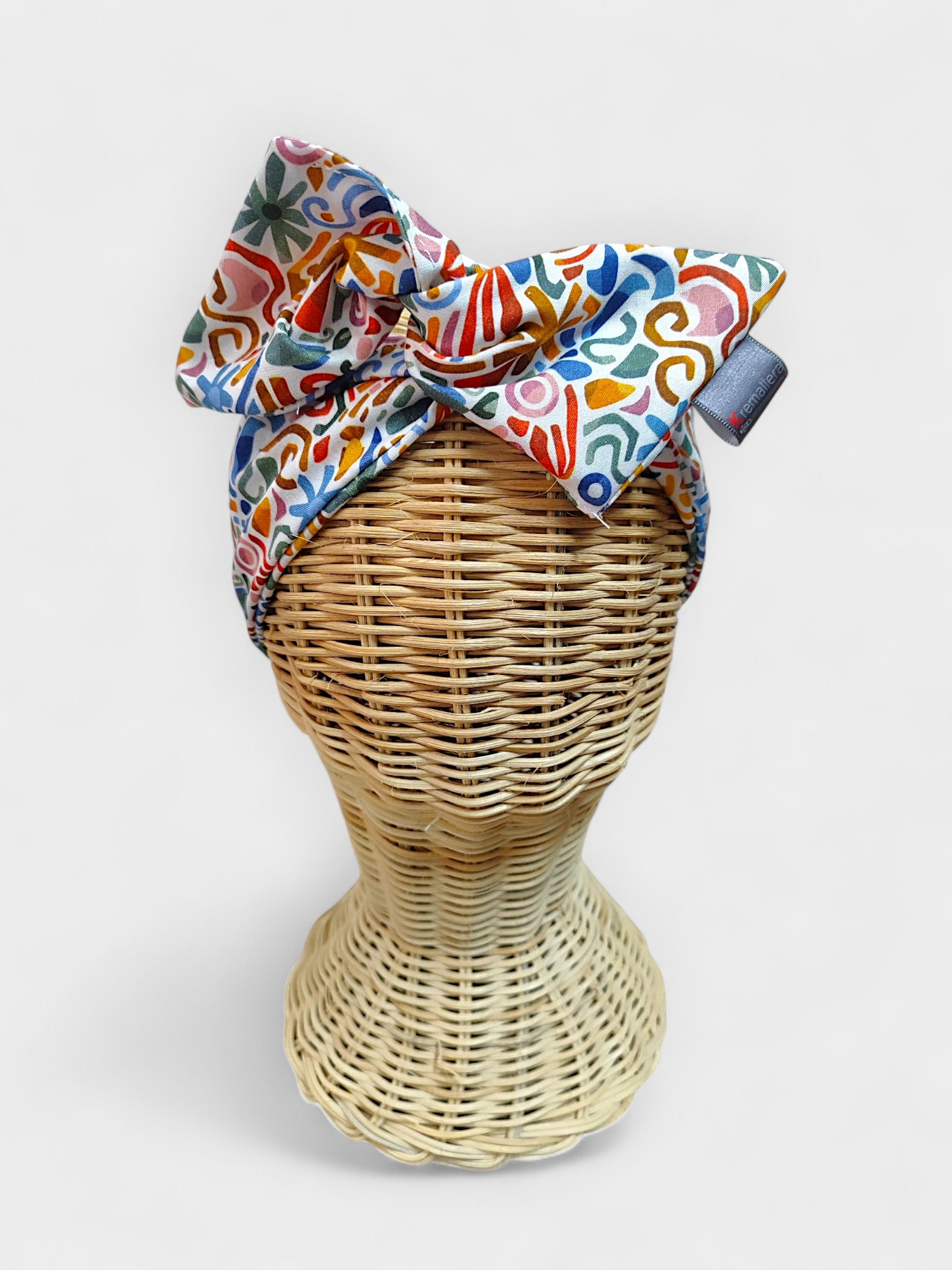 Faixa de cabeça de tecido estampado multicolorido