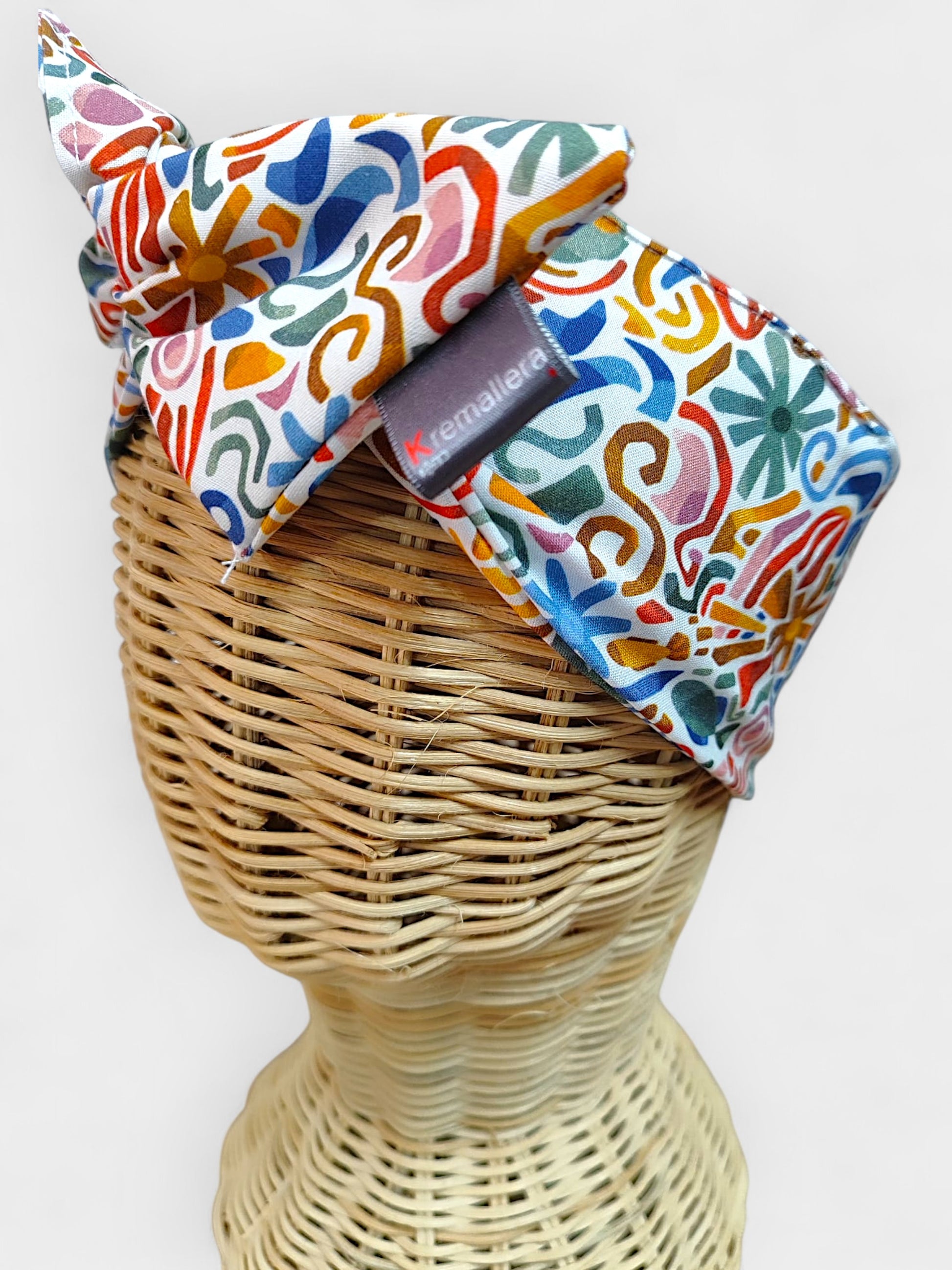 Faixa de cabeça de tecido estampado multicolorido